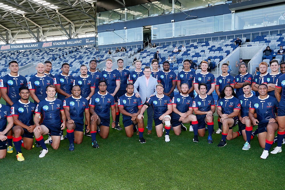 Photo: Tim Austin from ICS Service Solutions stands with the 2019 Melbourne Rebels squad