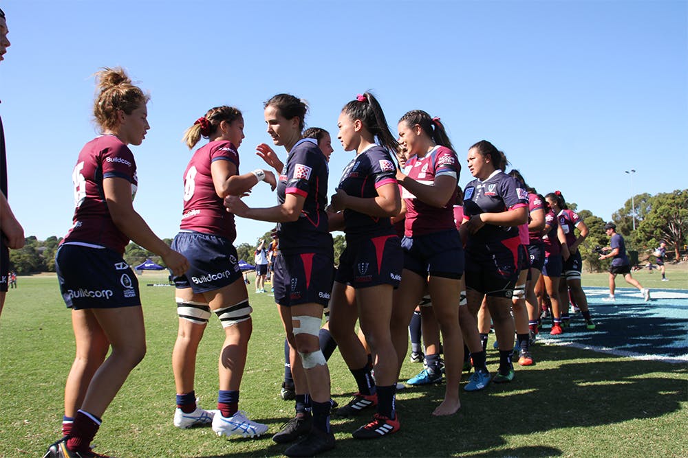 Rebels and Queensland player shake hands after their Round 1 Super W match at Box Hill RUFC.